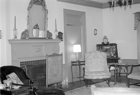 Interior of the Rosedale Plantation. Image courtesy of the State Archives of North Carolina. A sitting room. Ornate furniture adorns the room.